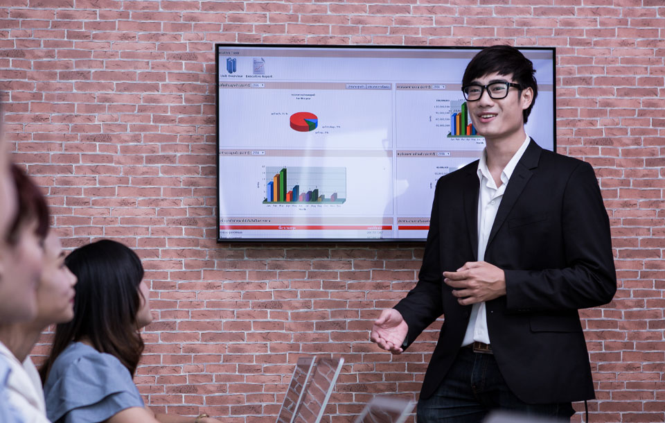 Smiling woman working on laptop