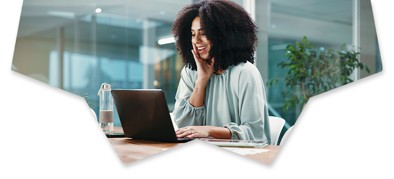 Woman with hand on her face looking at a laptop