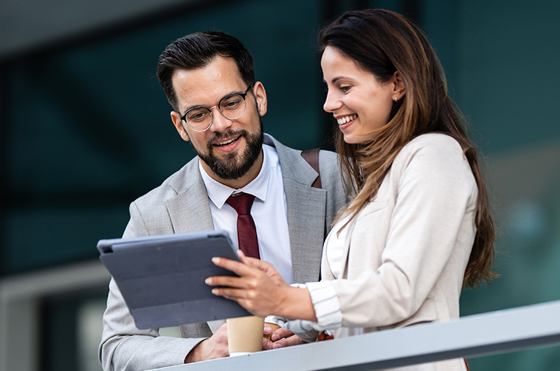 Two businesswomen working on a tablet