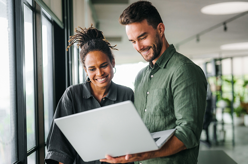 Two colleagues sharing a document