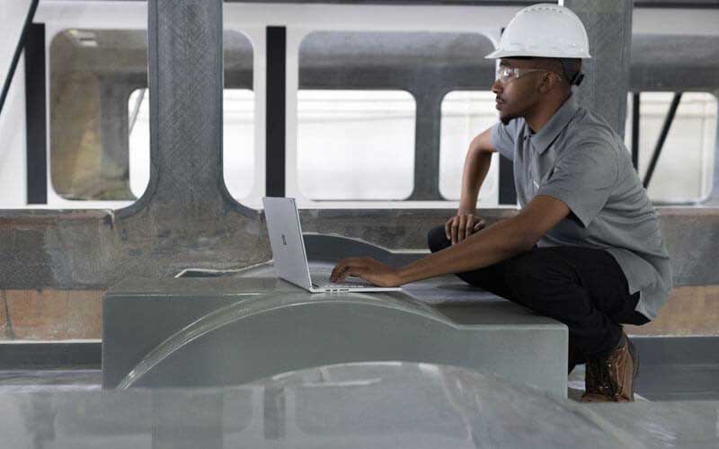 Engineer working on Microsoft Surface in the field