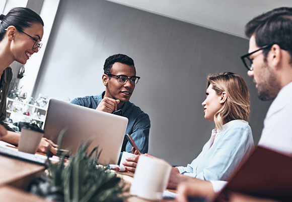 Colleagues talking during a meeting