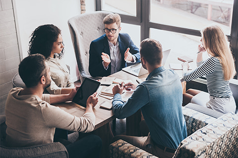 Colleagues working during a meeting