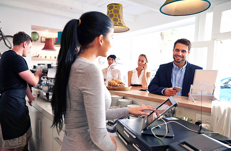 Businessman ordering at cafe